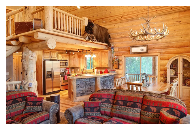 A living room filled with furniture and a high ceiling.