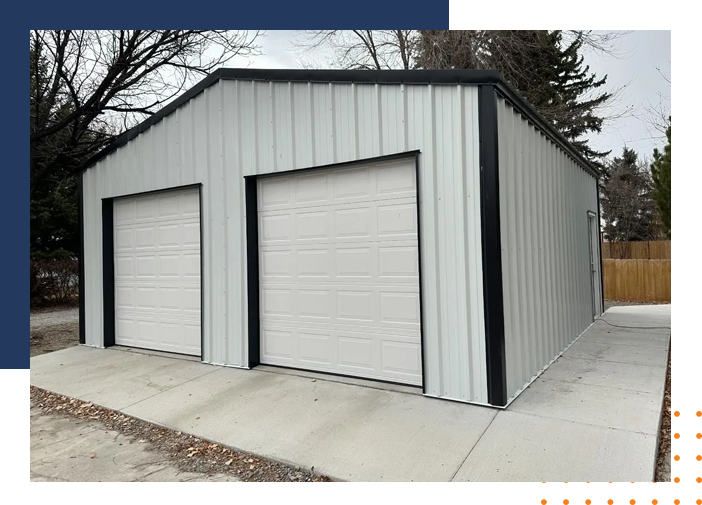 A white garage with two doors on the side of it.